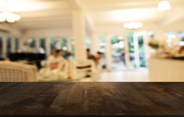 Empty wooden table in front of abstract blurred background of coffee shop . can be used for display or montage your products.Mock up for display of product