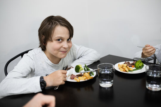 pic Baby Eating Steak Photoshoot https stock adobe com sk images family with 10 year old boy son eating a healthy meal of steak and vegetables at the dinner table 423661868 start checkout 1 content id 423661868