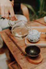 Woman serving Chinese tea in a tea ceremony.