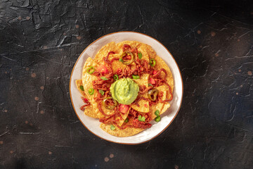 Nachos with beef and guacamole, overhead shot