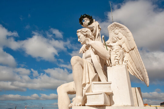 The four statues above The Rua Augusta Arch on the Praça do Comercio in Lisbon, Portugal