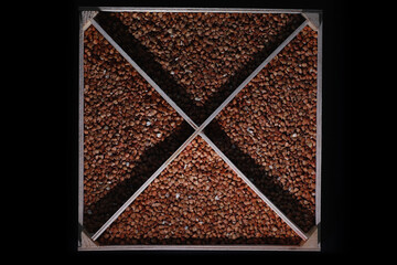 A set of grain cereals. Rice, buckwheat and millet groats in a wooden tray. A grocery set of...