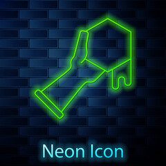 Glowing neon line Honeycomb and hand icon isolated on brick wall background. Honey cells symbol. Sweet natural food. Vector
