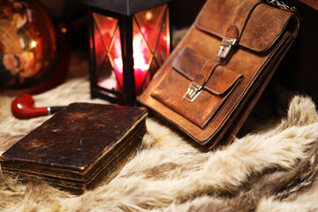 Retro old book and world desk globe on fur, learning and education concepts.