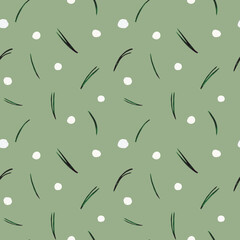 Pattern of pine needles with snow on a green background