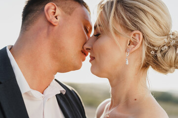 Portrait of a bride and groom in a sunset light