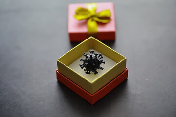 The concept of the world coronavirus pandemic. The geographical location of the virus. China flag and virus model and gift box.