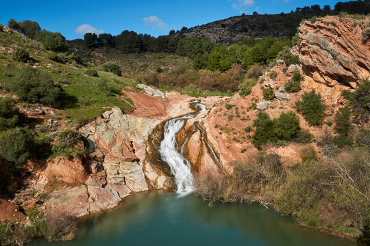 waterfall in the river Turon in the town of El Burgo, province of Malaga. Sierra de las Nieves, Spain