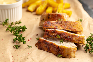 Grilled pork meat sliced on the kitchen table. Selective focus. Shallow depth of field.