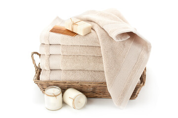 Bath towels in a wicker basket.