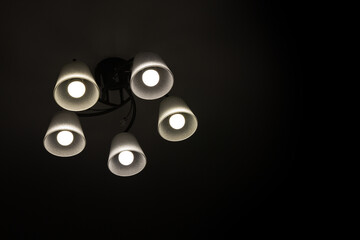 chandelier with five lamps in the night