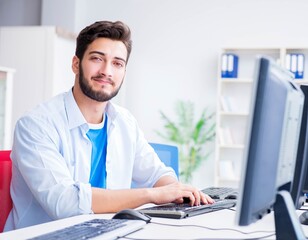 Businessman sitting in front of many screens