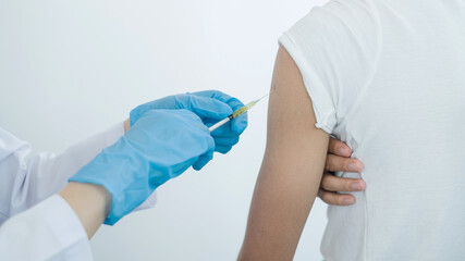 Fototapeta premium Female doctors vaccinated with syringes to prevent epidemics at hospitals, health care, and medical concepts