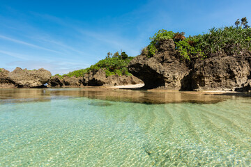 Scene of beautiful rocks typical of the coastal region and in front a beautiful natural pool that...