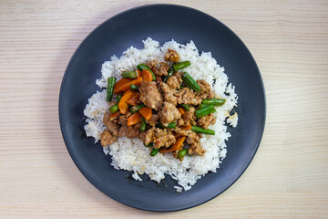Mince meat and green bean over steam rice.