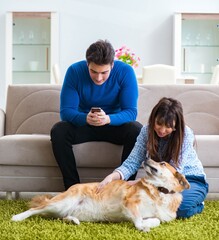 Happy family with golden retriever dog