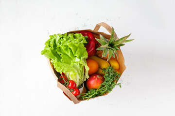 Healthy vegetarian food in paper bag from above