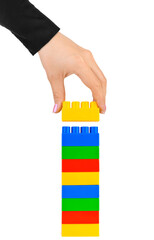 Fototapeta na wymiar Hand and toy tower