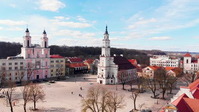 aerial shot in Kaunas. drone flies up near Kauno rotuse. view of Kaunas town hall squere. Kaunas old town on a sunny day.