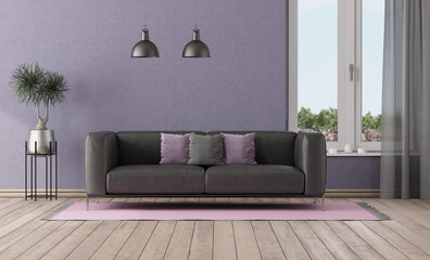 Purple room with black sofa and window