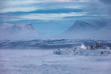 The frozen lake Torneträsk in Swedish Lapland. Beautiful ice forms create an amazing sight.