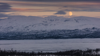 The frozen lake Torneträsk in Swedish Lapland. Beautiful ice forms create an amazing sight.