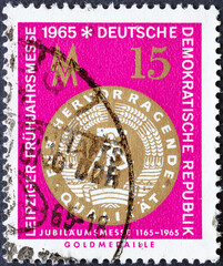 GERMANY, DDR - CIRCA 1965  : a postage stamp from Germany, GDR showing a gold medal (back) of the...