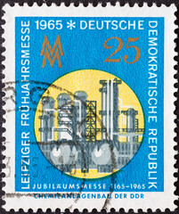 GERMANY, DDR - CIRCA 1965  : a postage stamp from Germany, GDR showing a chemical plant, trade fair...