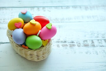 Close up of Colorful Easter Eggs on white wooden background.