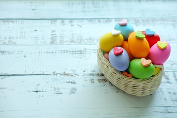 Close up of Colorful Easter Eggs on white wooden background.
