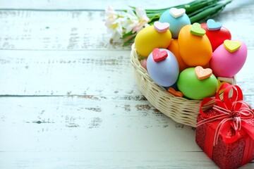 Close up of Colorful Easter Eggs on white wooden background.