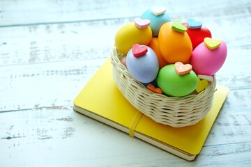 Close up of Colorful Easter Eggs on white wooden background.