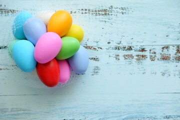 Close up of Colorful Easter Eggs on white wooden background.