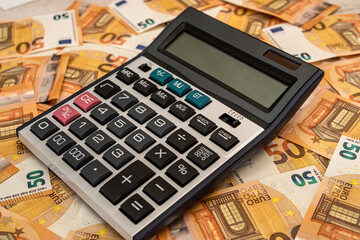 business and exchange concept with euro cash and calculator