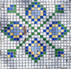 Fototapeta premium Old white mosaic wall with hole and rust, background from old mosaic.