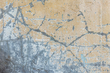 Fototapeta na wymiar Closeup fragment of grunge weathered wall of a building