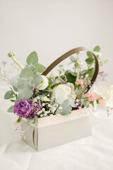 The girl's hands are holding a beautiful bouquet of flowers.
isolated on white background. flower composition