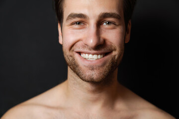 Fototapeta premium Shirtless white man smiling and looking at camera