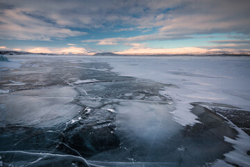 The frozen lake Torneträsk in Swedish Lapland. Beautiful ice forms create an amazing sight.