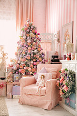 Christmas interior with decorated xmas tree and armchair