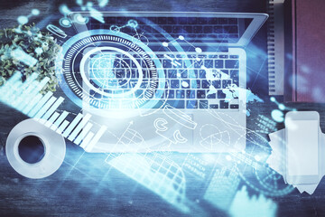 Business theme hologram drawings over computer on the desktop background. Top view. Multi exposure. Concept of international connections.