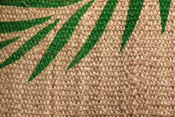 jute carpet with tropical leaf print - background  - Image