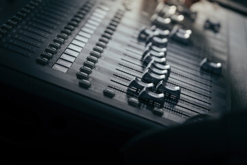 audio sound mixer controller at studio in dark background
