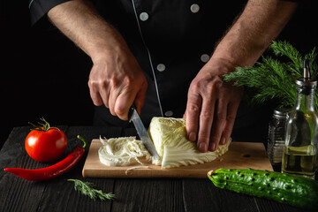 Chef hands cutting fresh chinese cabbage and vegetables for salad. Cooking and concept for restaurant or cafe
