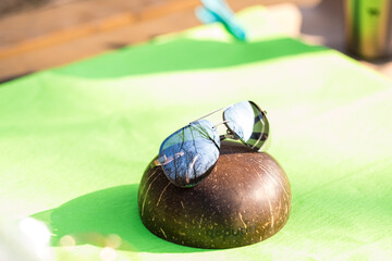 Aviator sunglasses model with big silver lenses shoot outside in a sunny day closeup . Selective focus. High quality photo