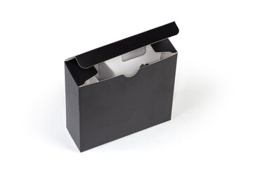 Opened black cardboard packing box of accessories to electronic device