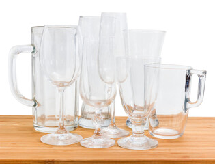 Various empty glass utensils on a wooden surface