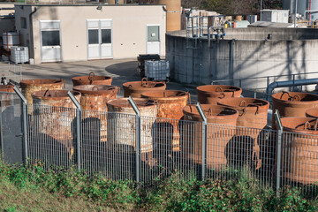 Group of Rusty Industrial Cylindrical Containers Grouped Outdoors