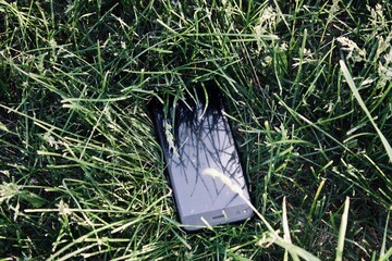 phone lost in the grass