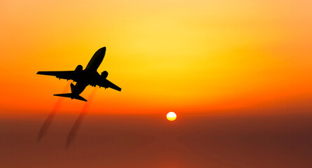 Airplane take off on a sunset.